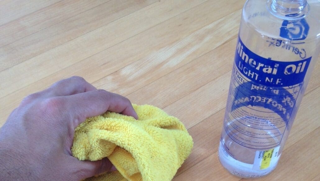 Mineral oil will reduce blemishes from sanding