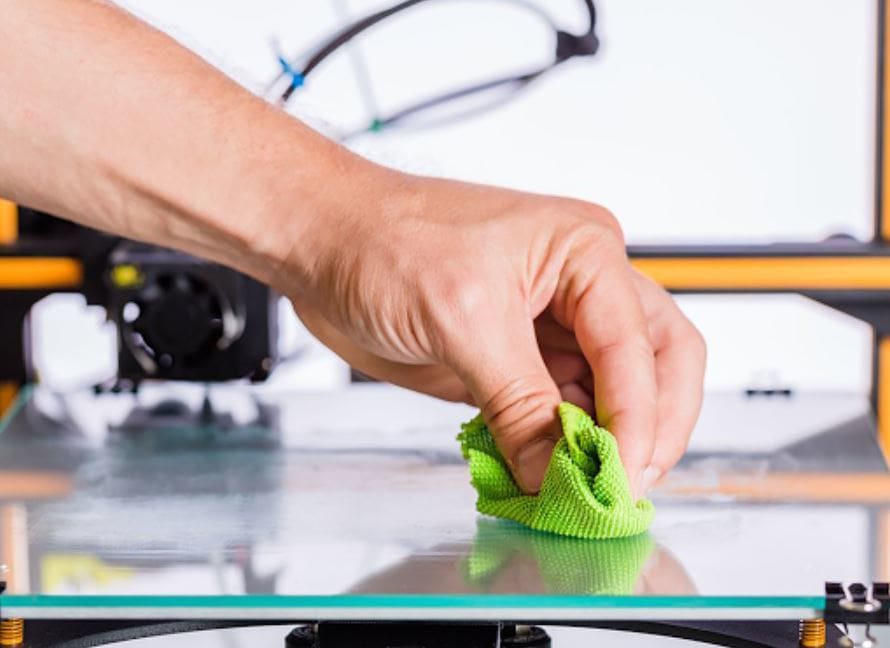 A damp cloth works great for cleaning a print bed
