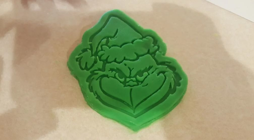 The maker recommends printing this Grinch-themed model in PLA with no supports