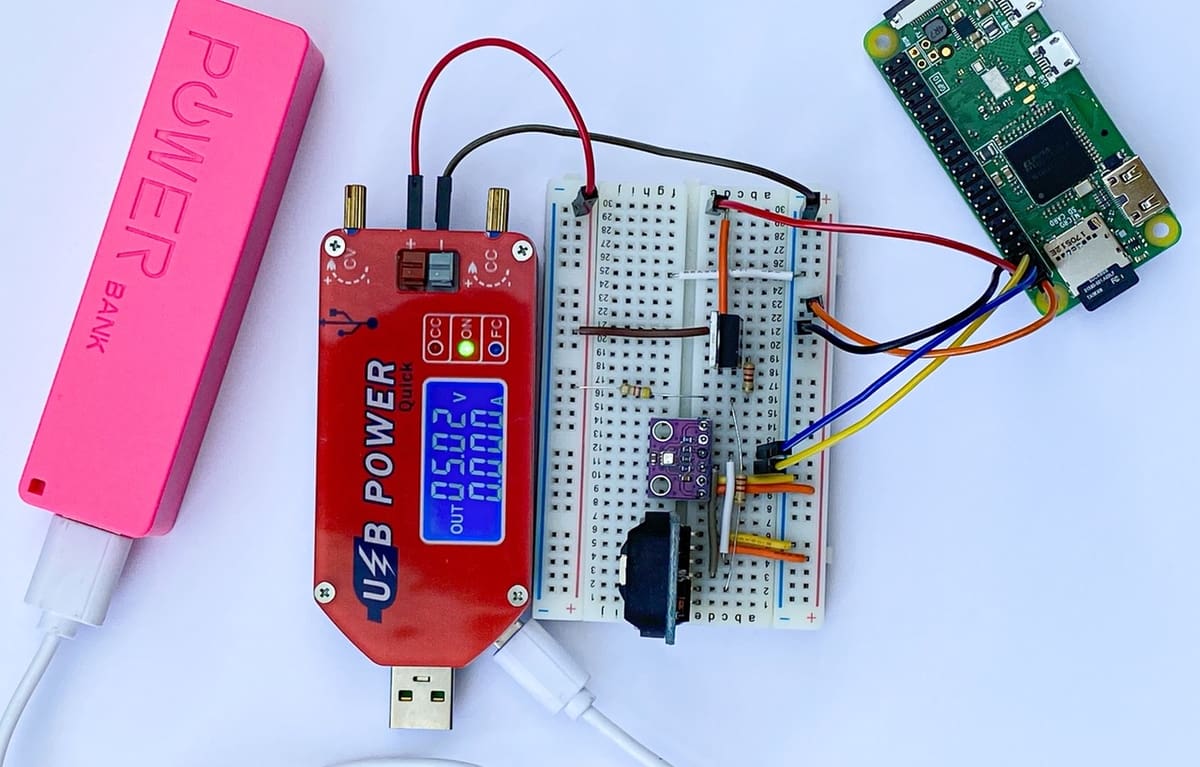 A Raspberry Pi Zero connected to a power meter reading zero current