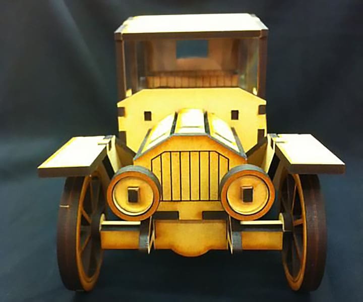 This laser cut car's wheels go round and round