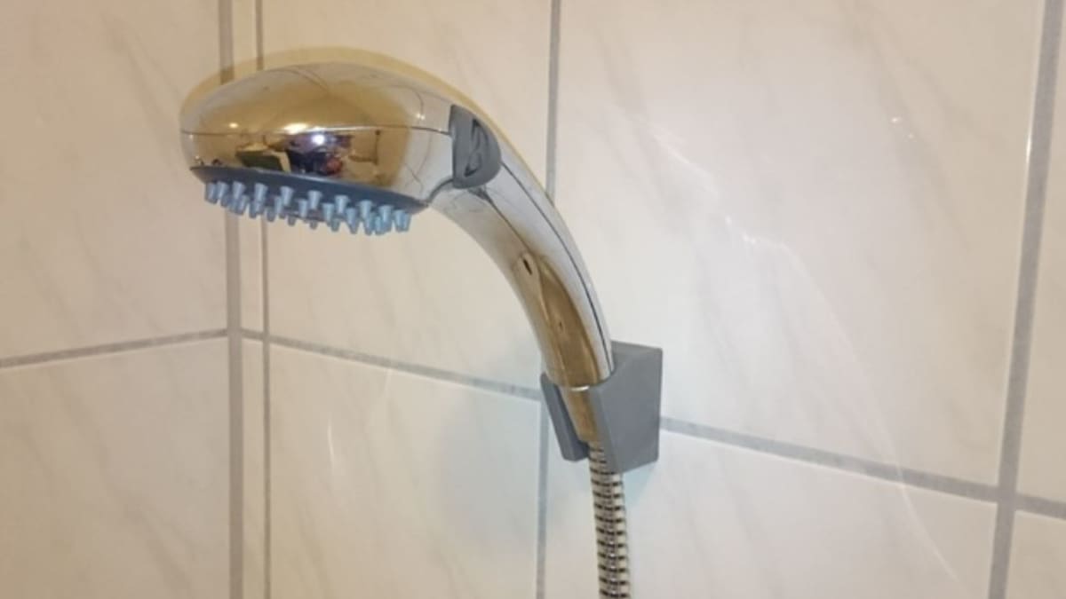 This model has two mounting holes for attaching the mount to a wall