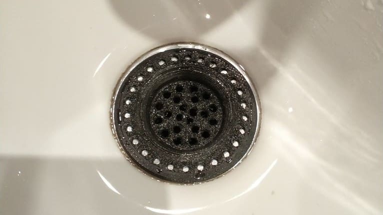 This grate is meant to stop hair from clogging your shower drain