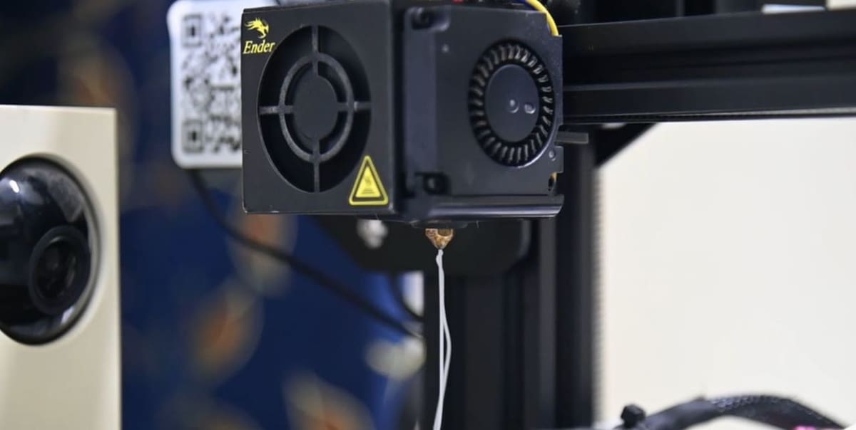 The filament should purge out of the nozzle