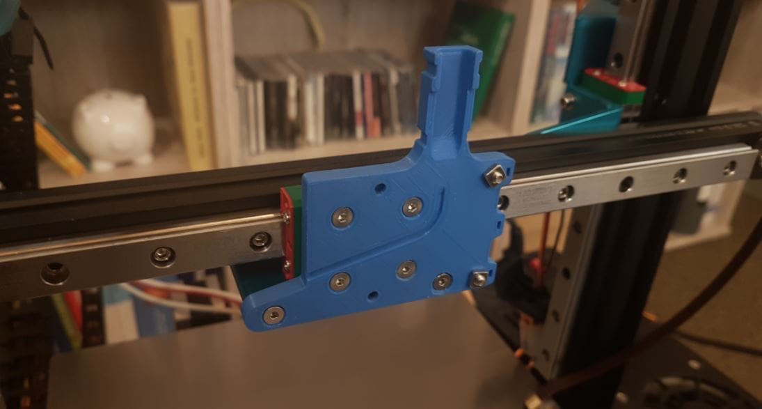 You can use a 3D printed mount to attach your printhead or carriage to a linear rail