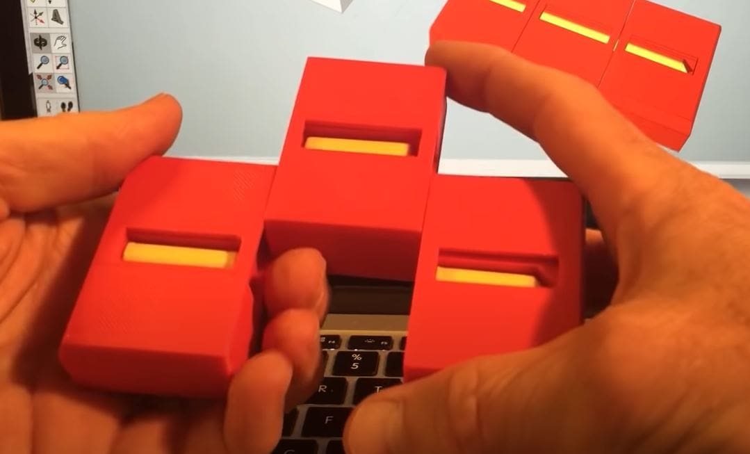 You should look at the fully assembled 3D model to visualize how this trick works
