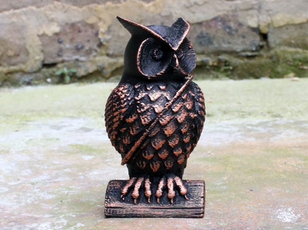This owl is carrying a small mail sack over its shoulder