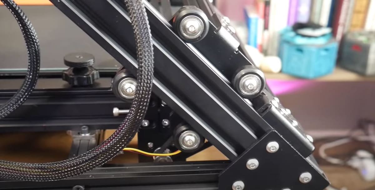 The CR-30 uses rubber and plastic roller bearings on 4020 aluminum V-slot extrusions