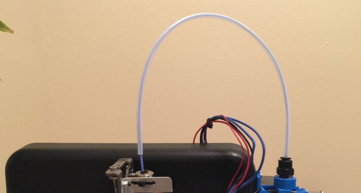 PTFE tubing connects the hot end to the extruder