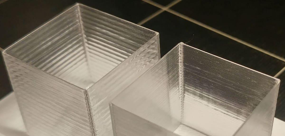 PID tuning your heated bed can prevent the bulging layers seen on the cube to the left