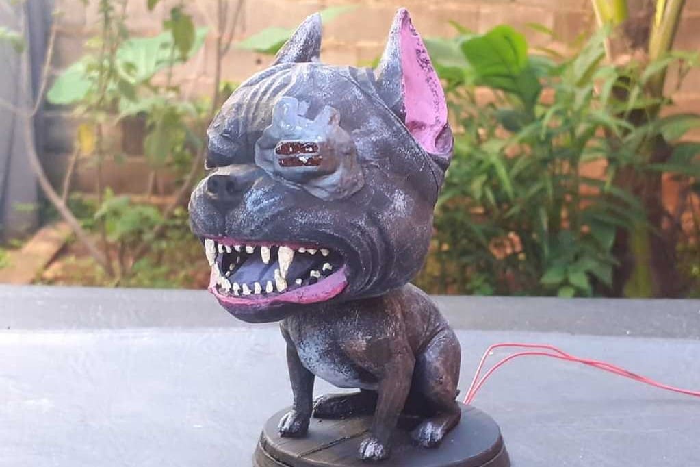 This bobble head is both cartoonish and dangerous at the same time.