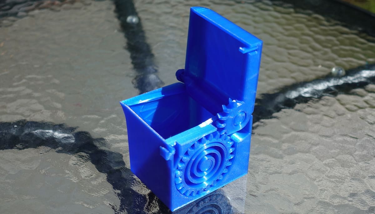 A 3D printed, spring-loaded, print-in-place box