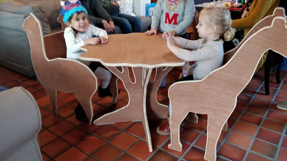 Llama and giraffe chairs with a tree table