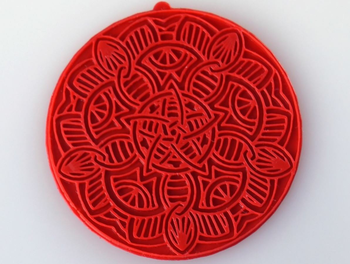 This mandala pendant was inspired by childhood memories
