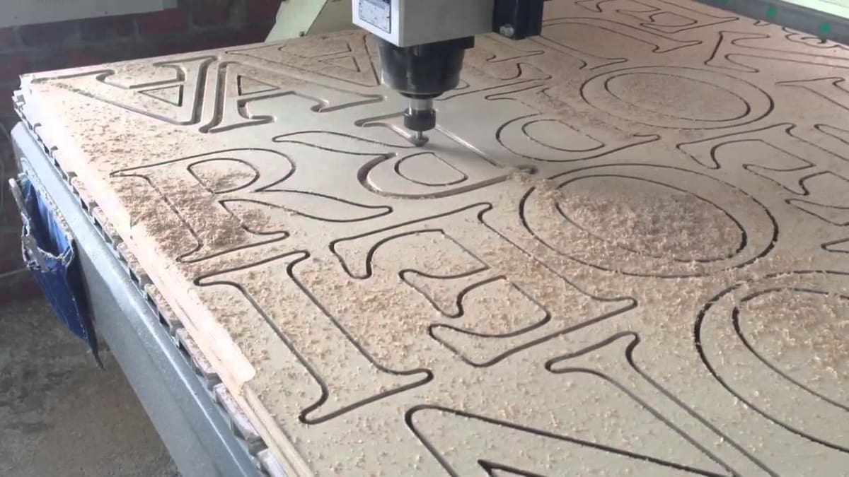A CNC router engraving letters