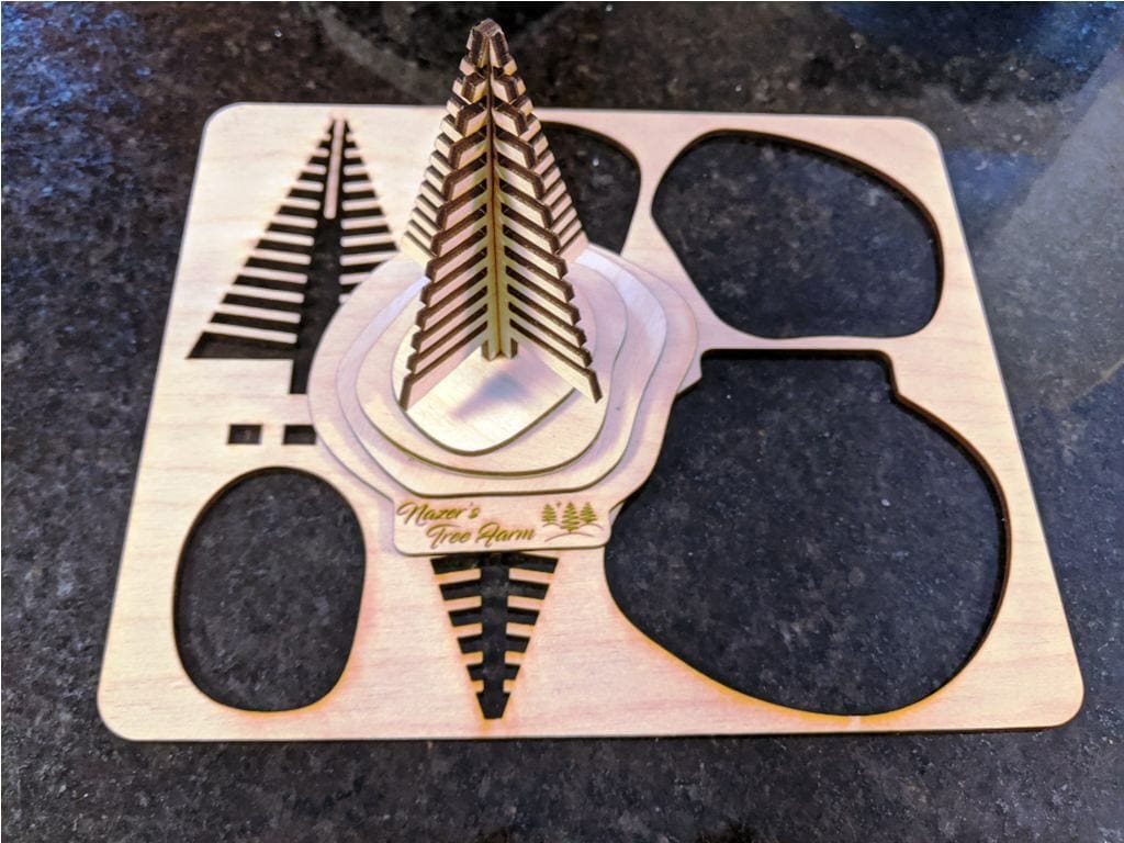 A CNC laser-cut Christmas tree puzzle