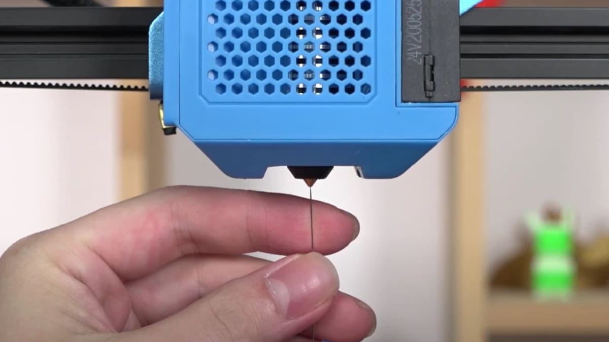 You can use a needle to clean your nozzle