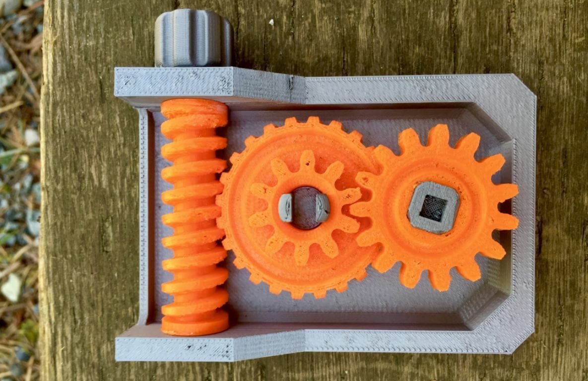 In a worm gear mechanism, spinning the gear rotates the threaded screw piece