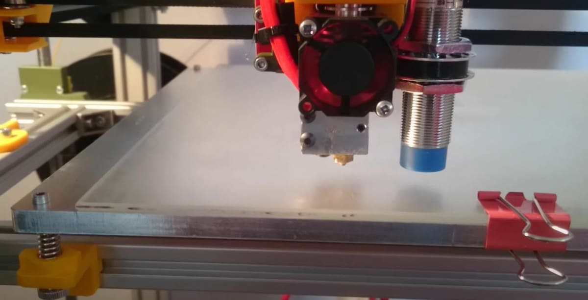 If you have a non-metal build plate, try a more sensitive inductive sensor or a thinner plate