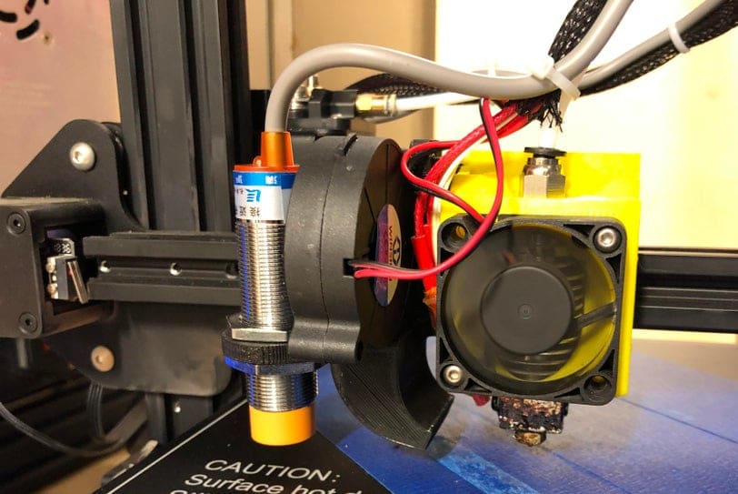 On the left is a mechanical endstop and on the right is an inductive sensor