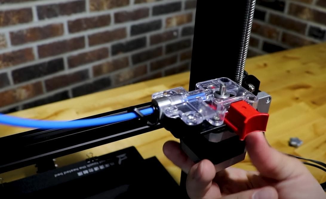 The EZR Struder has a PTFE tubing clip to keep it locked into the extruder