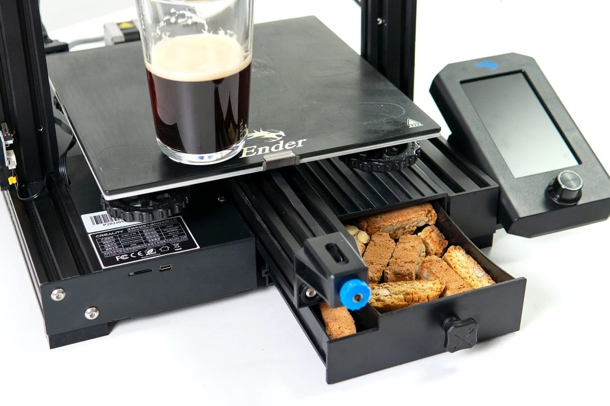 The Ender 3 V2's storage drawer is great for a mid-nozzle-replacement snack