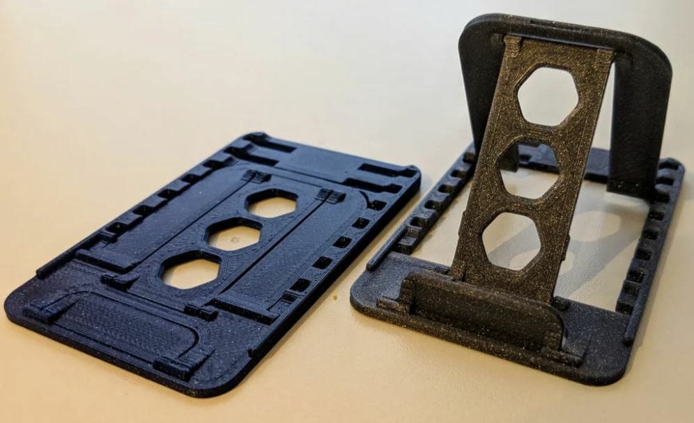 This device stand can extend from its flat form, making it extra portable