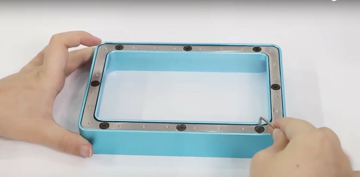 Disassembling the vat to access the film