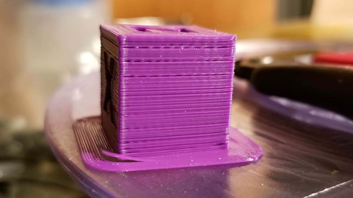 Raising your hot end temperature fixes under-extrusion, which can help solve layer separation