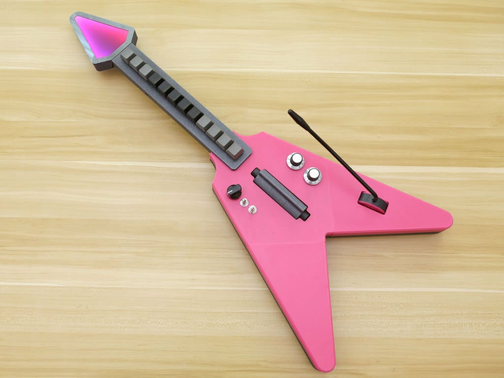 It's a MIDI guitar with mechanical key switches and a whammy bar!