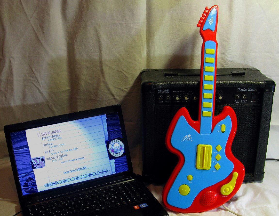 It's a toy guitar! No, it's an Arduino based guitar hero controller!