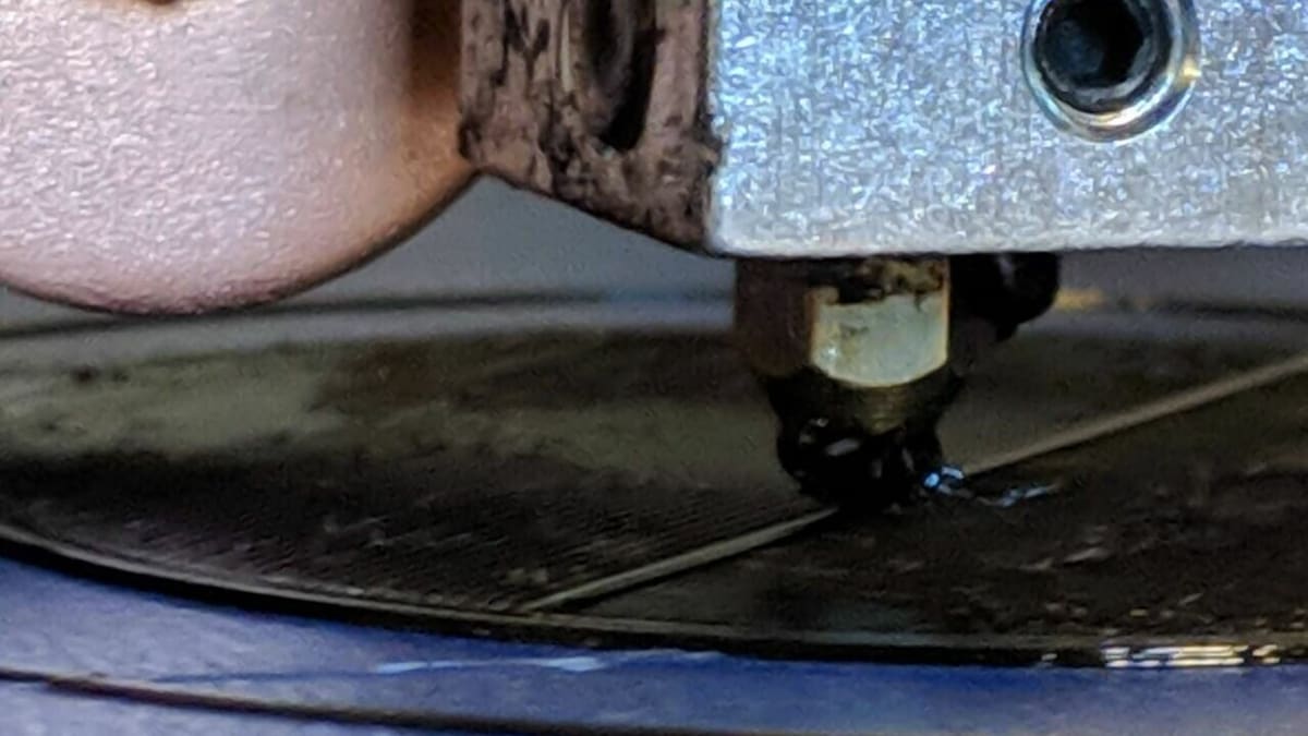 A dirty nozzle can cause material to stick to its exterior