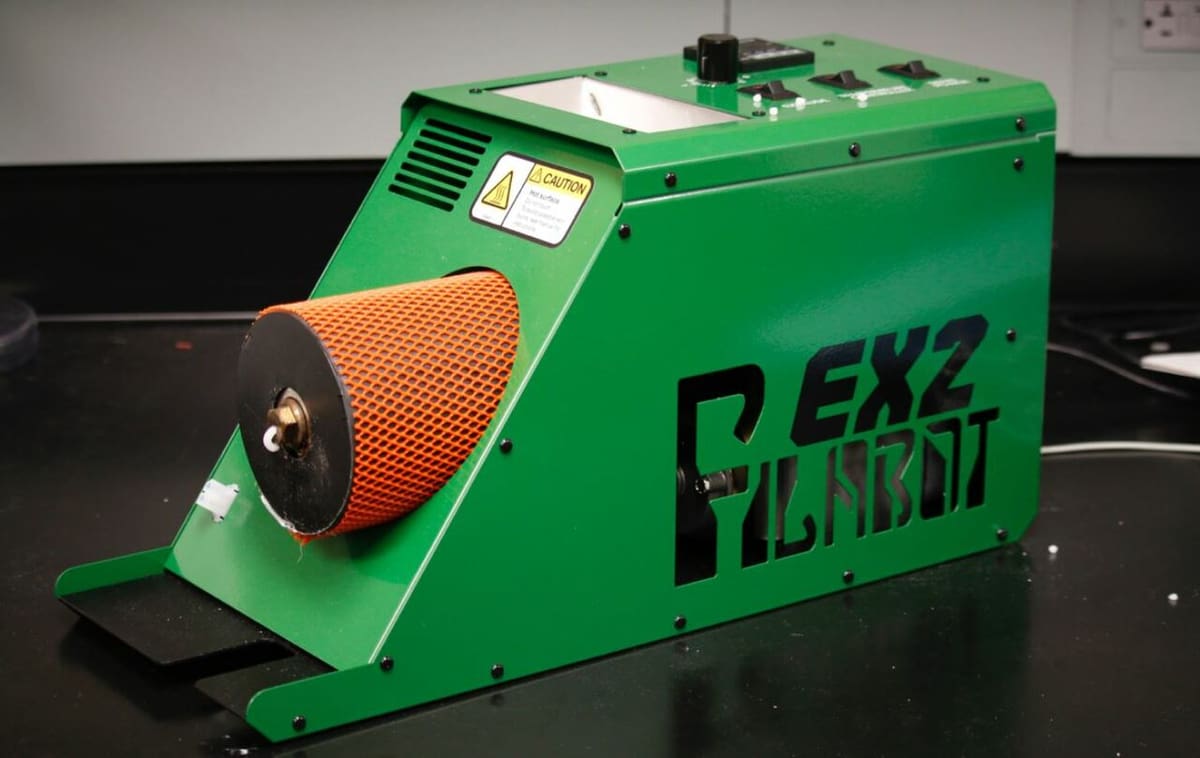 The EX2 is packed into a sleek green case