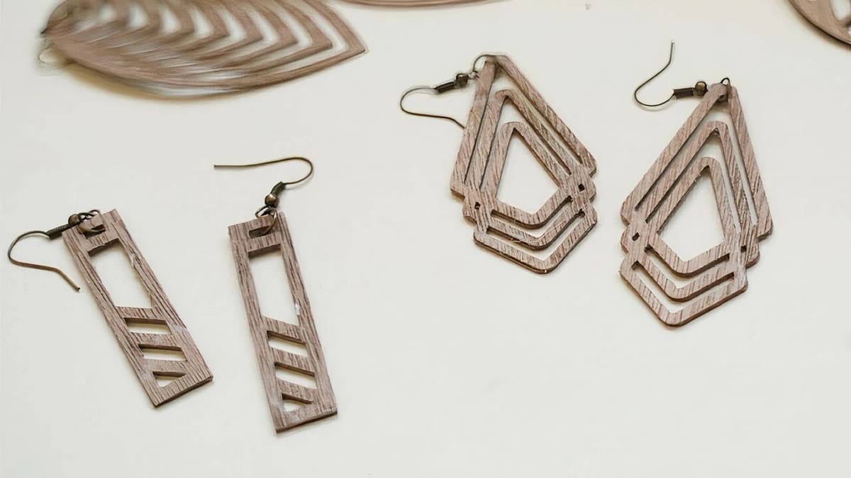 Walnut wood veneer earrings with intricate designs