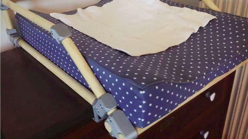 This rail will keep the baby from falling off the sides