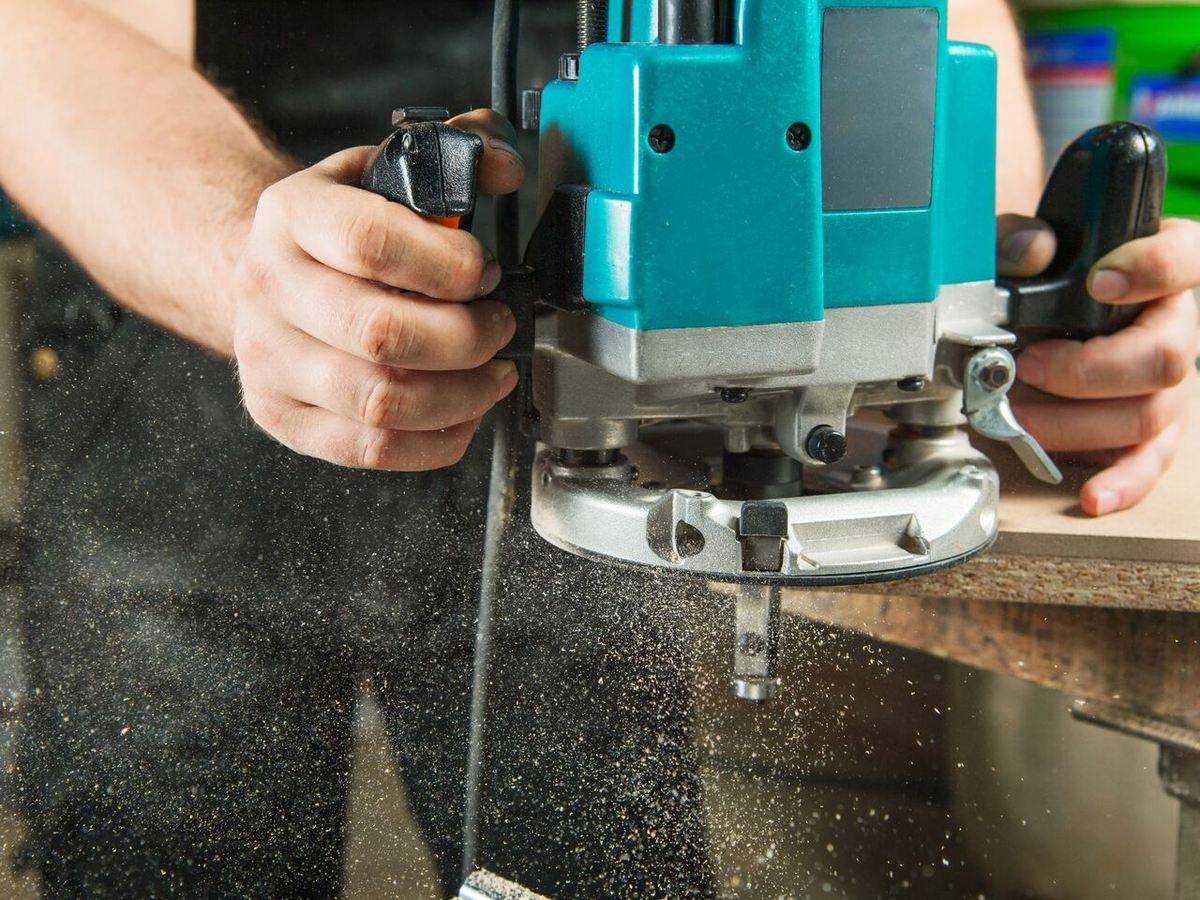 Handheld wood routing is done almost exclusively using conventional milling, as it's safer and easier to control
