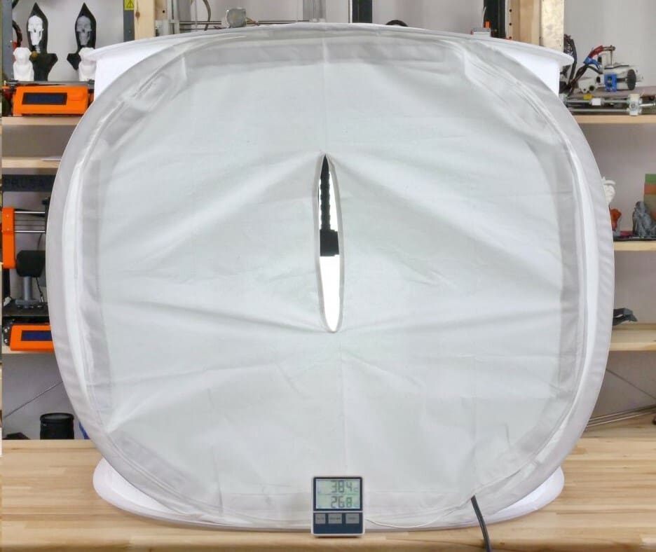 A Photo Studio tent isn't super insulative but is a very inexpensive enclosure option
