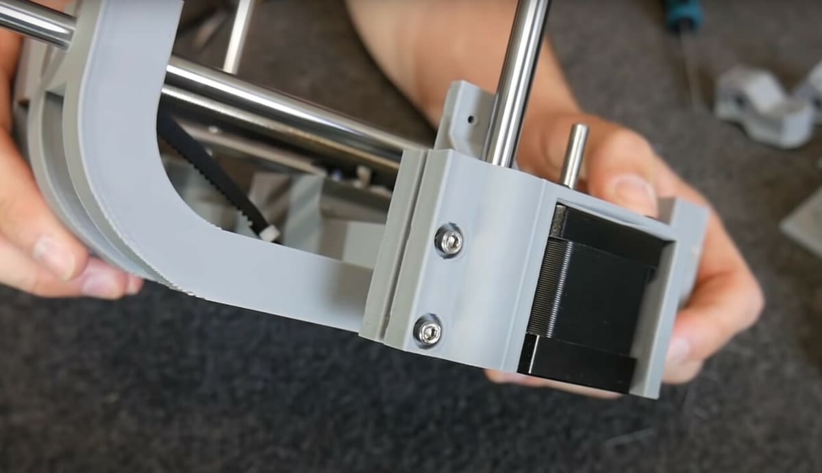 A linear rod inserted into a slotted hole, tightened down for a secure fit