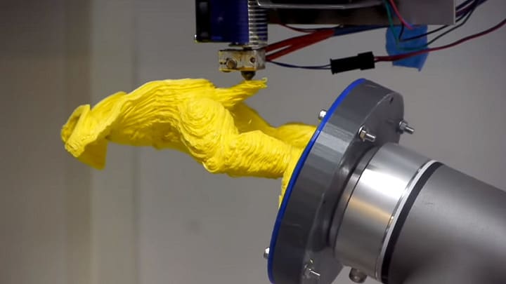 A 5-axis printer with a rotating bed
