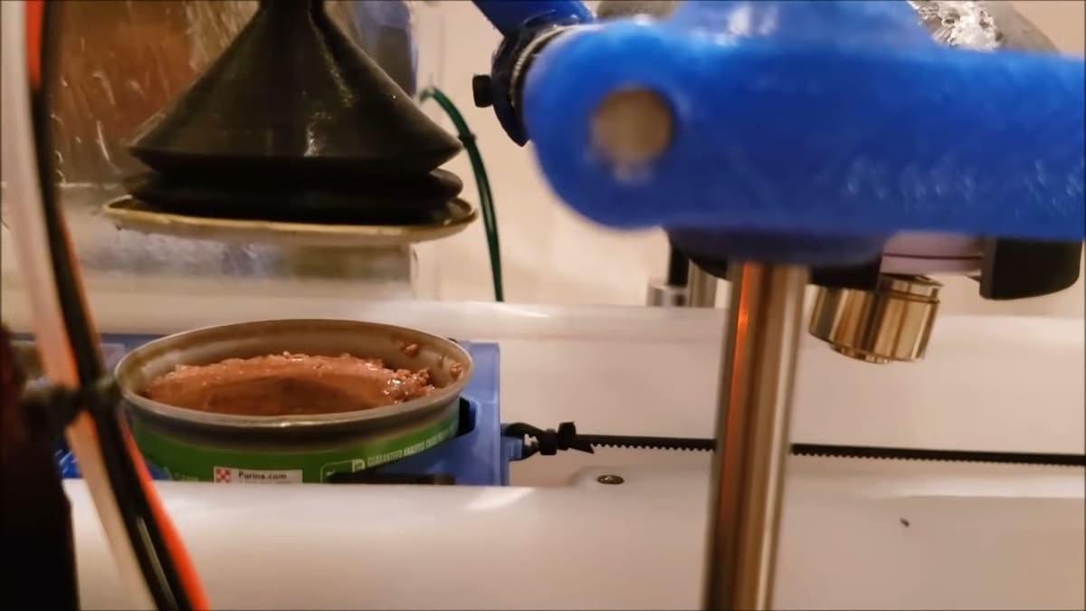 This awesome feeder can open a wet food tin!