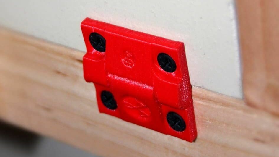 This standard hinge features two screw holes on each side piece