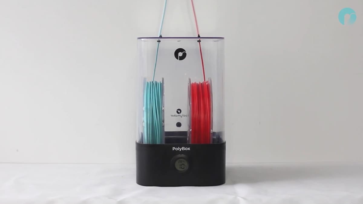 The PolyBox II can fit a few spools of filament and has feeder holes so you can use the stored materials