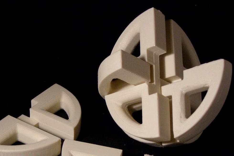This puzzle involves six similar pieces that link together