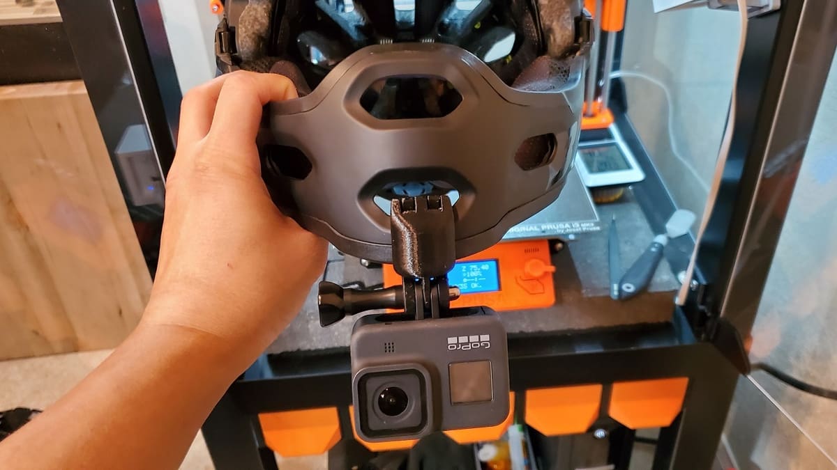 You can attach a generic GoPro camera mount to the end of this chin mount