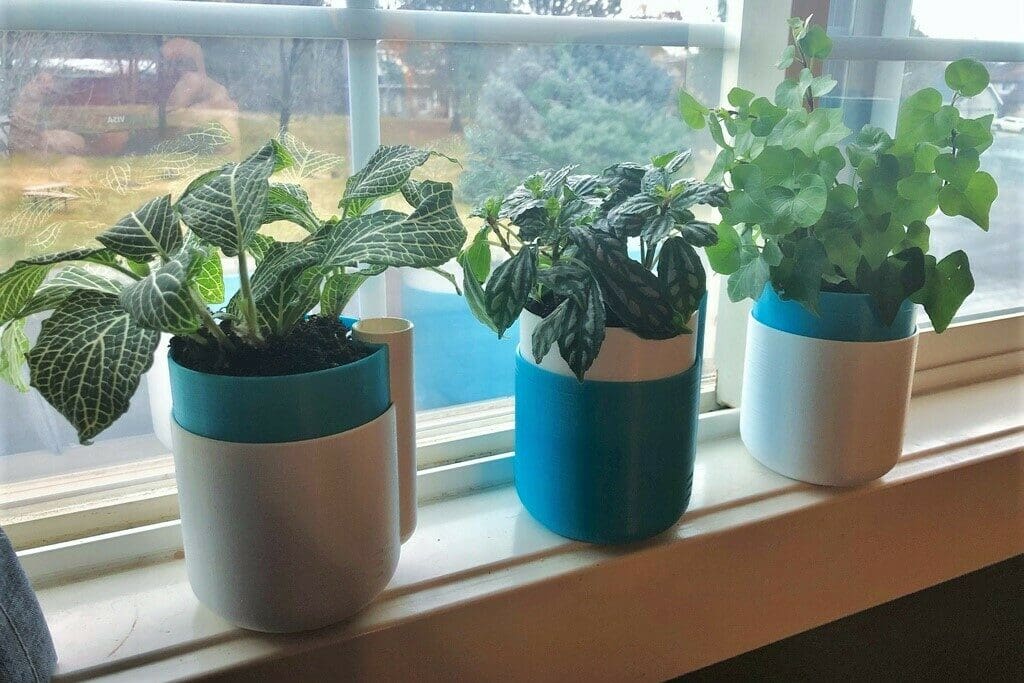 How many self-watering planters will you print with 1 kg of PLA?