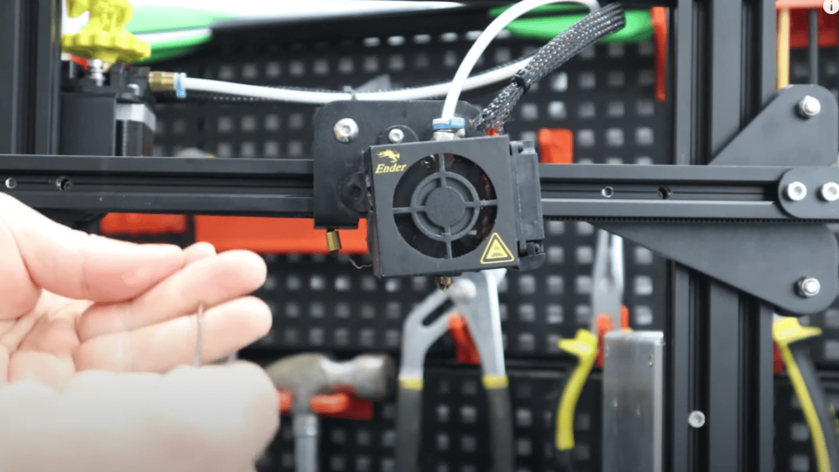 A higher nozzle temperature increases the hot end pressure, causing stringing