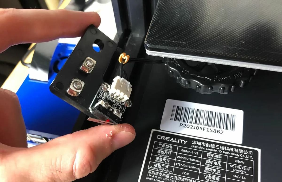 Unscrew and remove the printer's stock Z-axis endstop