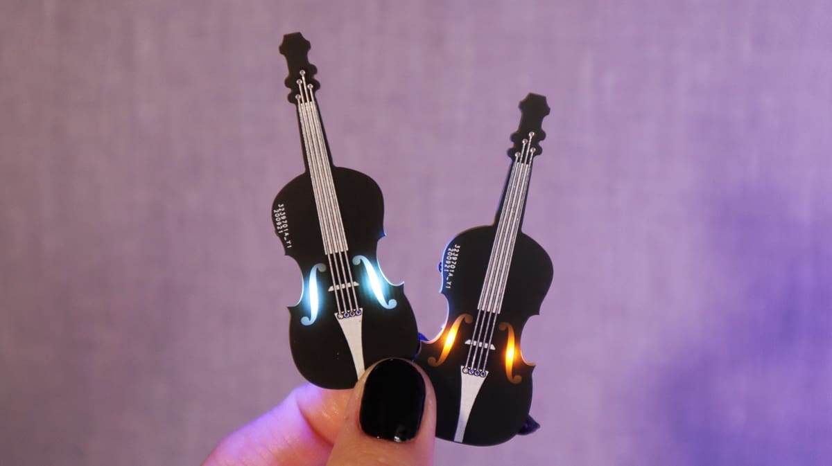 The mini PCB violin plays music and flashes to the beat
