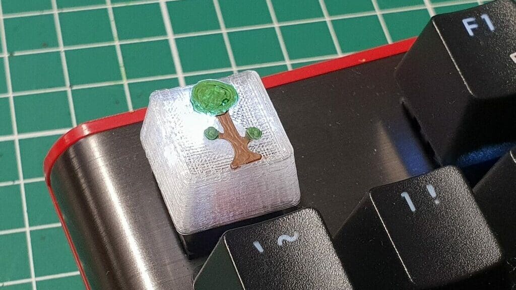 A Terraria keycap printed in clear PLA and painted with acrylic