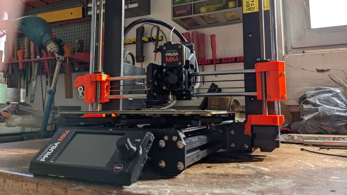 The Prusa MK4 resembles the letter 'H', with the X-axis gantry moving along the Z-axis